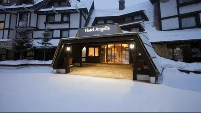 a hotel lobby with snow in front of a building at Tim 135 Konaci-Angella Centar in Kopaonik