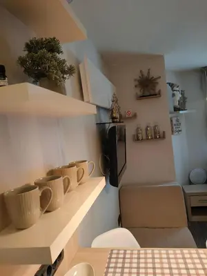 a room with a bunch of pots on a shelf at Tim 135 Konaci-Angella Centar in Kopaonik