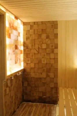 a shower with a brick wall in a room at Lux apartment Milmari Reko E4 Kopaonik in Kopaonik