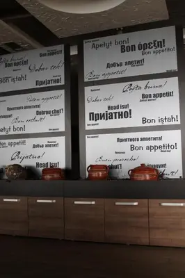 a stage with a bunch of signs on the wall at Lux Apartment Milmari Reko Premier 14 Kopaonik in Kopaonik