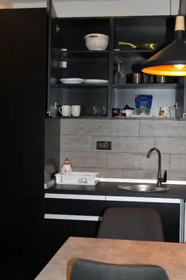 a kitchen with a sink and a counter top at Lux Apartment Milmari Reko Premier 14 Kopaonik in Kopaonik