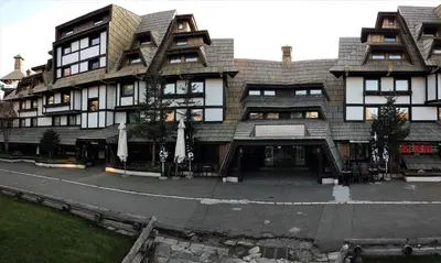a large building with a courtyard in front of it at Angella Konaci Kopaonik in Kopaonik