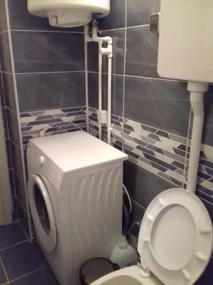 a bathroom with a white toilet and a sink at City Center Apartment JOTIC in Pirot