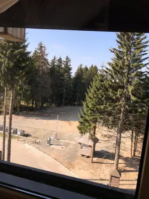 a view of a park from a window at Apartman Viktor in Kopaonik