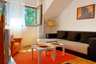 a living room with a couch and a table at Stella Apartments in Vrnjačka Banja