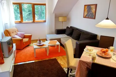 a living room with a couch and a table at Stella Apartments in Vrnjačka Banja