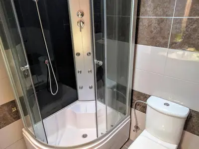 a bathroom with a shower with a toilet at Stella Apartments in Vrnjačka Banja