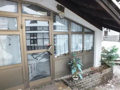 a front door of a house with windows at Apartment 102, Vila 