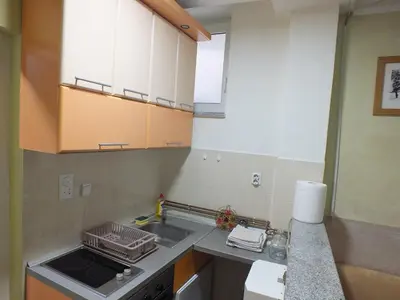 a small kitchen with a sink and a stove at Apartment 102, Vila 