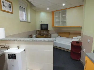 a hotel room with a bed and a bathroom at Apartment 102, Vila 