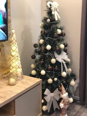 a christmas tree with ornaments on it at Milmari Resort Premier 47 in Kopaonik