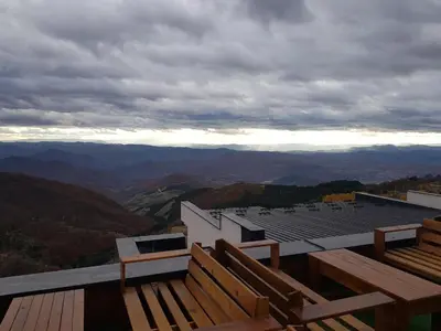 a view of a roof of a building with mountains at Milmari Resort Premier 47 in Kopaonik