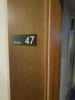 a sign on the door of a room with at Milmari Resort Premier 47 in Kopaonik