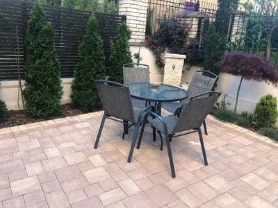 a table and chairs sitting on a patio at Vrnjacka Idila in Vrnjačka Banja