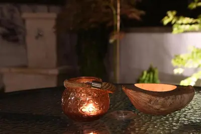 a brown vase and a wooden bowl on a table at Vrnjacka Idila in Vrnjačka Banja