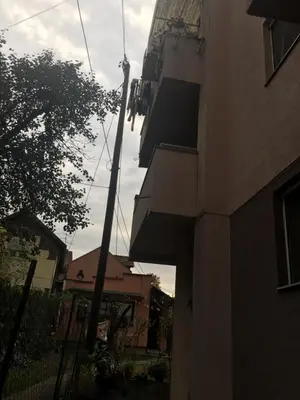 a pole next to a building next to a building at Apartmani Milica in Kruševac