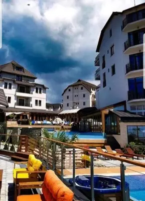 a view of a hotel with a swimming pool at Ogi & Una Premijer 42 in Kopaonik