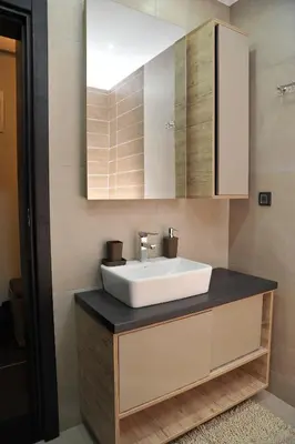 a bathroom with a sink and a mirror at MISS Premier 19 Milmari in Kopaonik