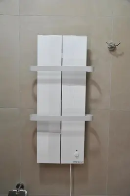 a white shelving unit on a wall at MISS Premier 19 Milmari in Kopaonik