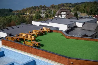 an overhead view of a building with a green lawn at MISS Premier 19 Milmari in Kopaonik
