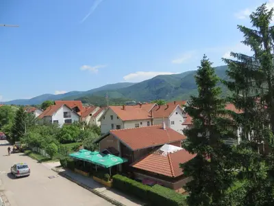 an aerial view of a town with houses and mountains at Bisa in Soko Banja