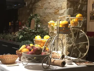 a bunch of fruit in baskets on a table at Apartman Lux Kopaonik in Kopaonik