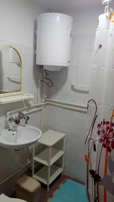 a bathroom with a sink and a mirror at Sky in Kopaonik