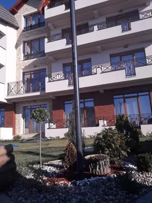 a building with windows and a pole in front of it at Apartman Lux Premier 09 Kopaonik in Kopaonik