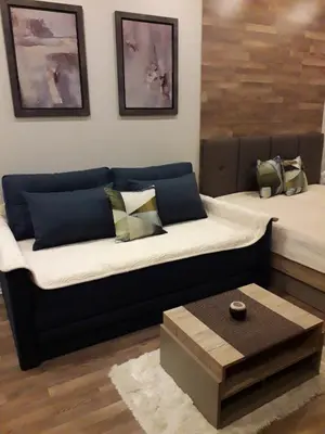 a living room with a couch and a coffee table at Apartman Lux Premier 09 Kopaonik in Kopaonik