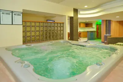 a hot tub in the middle of a room at Hill Wellness & Spa in Jagodina