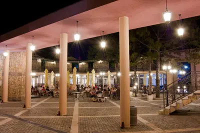 a group of people sitting in a patio at night at Hill Wellness & Spa in Jagodina