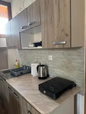 a kitchen with a counter top with a tea kettle at Sky apartments Kopaonik in Kopaonik
