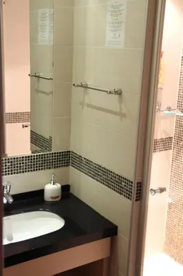 a bathroom with a sink and a mirror at Kopaonik011 Konaci&WoodSide Apartments in Kopaonik