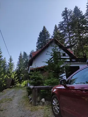 a car parked in front of a house at Uki & Sofi mountain house in Kopaonik
