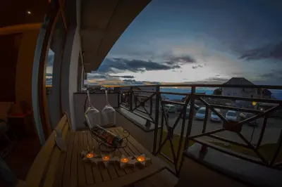 a balcony with a bench and a view of a harbor at Milmari Premier 15 in Kopaonik