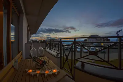 a balcony with a bench and a view of the ocean at Milmari Premier 15 in Kopaonik