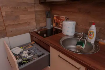 a small kitchen with a sink and a counter top at Milmari Premier 15 in Kopaonik