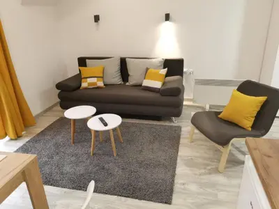 a living room with a couch and a table at Vila Vrh in Crni Vrh
