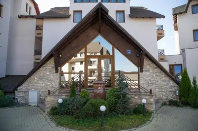 a building with a large window on the side of it at Apartman Nena b15 in Kopaonik