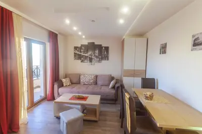 a living room with a couch and a table at Snow Oasis Kopaonik in Kopaonik