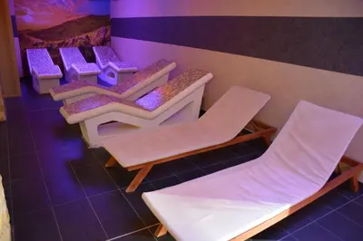 a group of chairs and tables in a room at Snow Oasis Kopaonik in Kopaonik