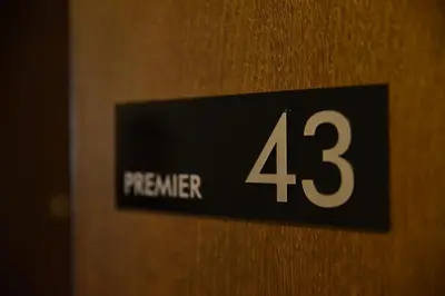 a sign on a door with the number at Milmari Apartment 43 Premier Pollo in Kopaonik