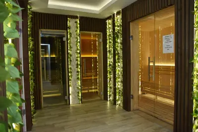 a hallway with glass doors with ivy at Milmari Apartment 43 Premier Pollo in Kopaonik