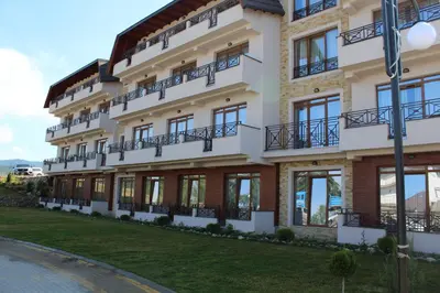a large building with balconies on the side of it at As Lux Apartmani Kopaonik in Kopaonik