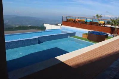 a swimming pool on top of a house at As Lux Apartmani Kopaonik in Kopaonik