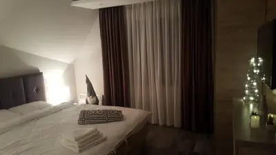 a hotel room with a bed with towels on it at Milmari Resort Premier 46 in Kopaonik