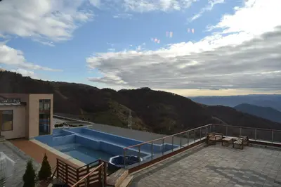 a view of a swimming pool on top of a building at Milmari Resort Premier 46 in Kopaonik
