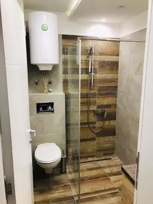 a bathroom with a toilet and a shower at Milmari Resort Premier 46 in Kopaonik