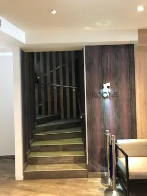a staircase in a building with a sign on the wall at Apartmani Air in Kopaonik
