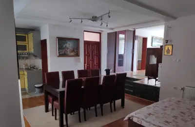 a dining room with a table and chairs at Allegro dream in Vranje